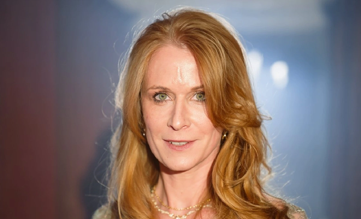 Ann Cowherd and Colin Cowherd smiling together at a family event